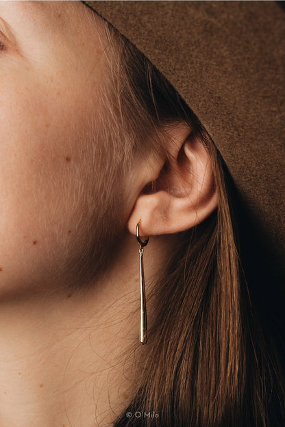 Vela Golden Pendulum Earrings